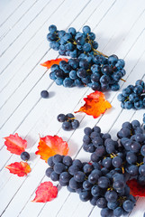 red grapes on white wood table