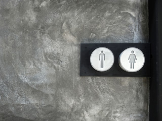 stainless steel Toilet sign on Polished plaster wall