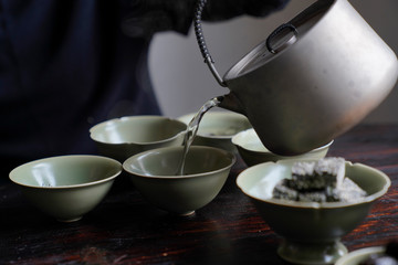 Tea wares placed on wooden shelves and tables
