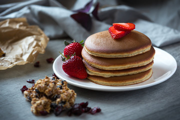 Photo of trendy asian food fluffy pancake, Japan pancake, souffle pancake with syrup and strawberry for menu, web or app using.