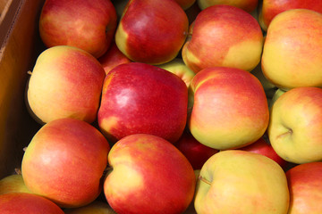Apples background, fresh fruits on wood table, top view