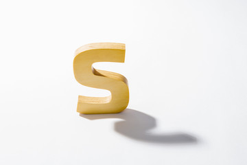 Wooden Alphabet S and Shadow Reflection.