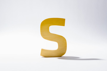 Wooden Alphabet S and Shadow Reflection.