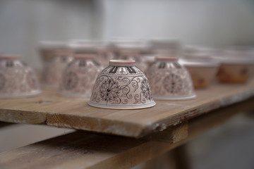 Coloured ceramic cups placed upside down