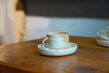 a cup on wooden table