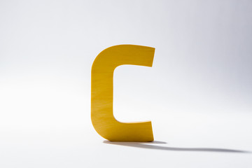 Wooden Alphabet C and Shadow Reflection.