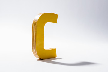 Wooden Alphabet C and Shadow Reflection.