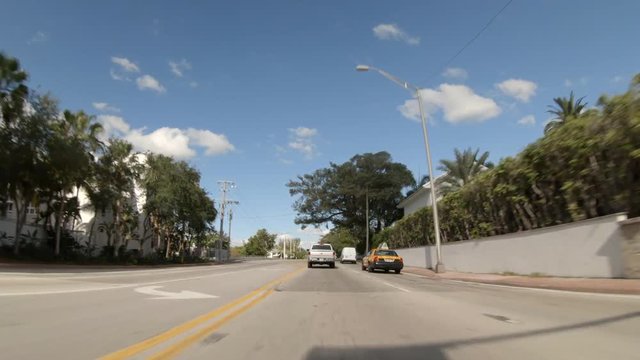 Driving plates Miami Beach 63rd Street front view 4k 60p