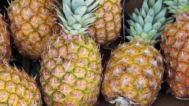 Raw and ripe pineapple in supermarket