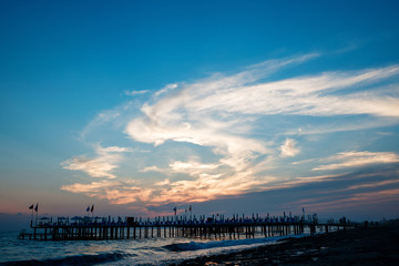 Fototapeta premium Beautiful view on coast pier on rocky beach.