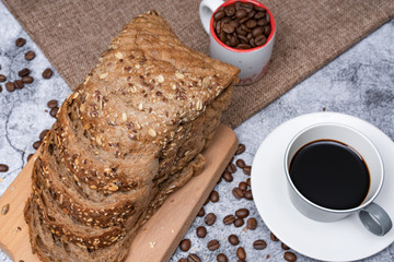 Coffee and bread are on the table
