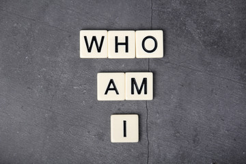 Personality identifying question Who am I formed with letter tiles 