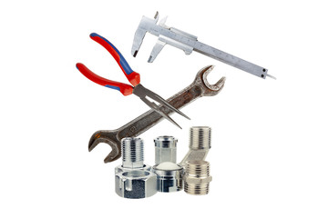 Metal adapters for water supply with the tool on a white background
