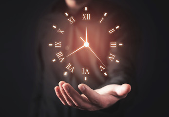 Man holding clock. Business time management