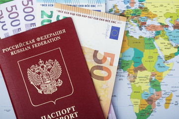 Map, money and international passport as a traveling essentials	