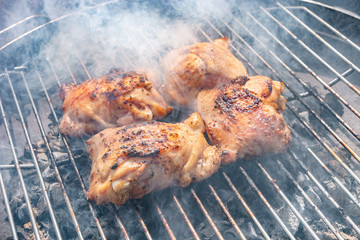 Grilled chicken legs in outdoor at home balcony