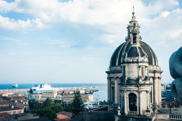 Obraz premium Domes of the Cathedral dedicated to Saint Agatha. The view of the city of Catania, Sicily, Italy .