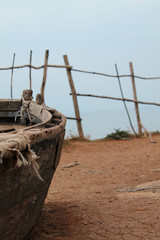 Fototapeta na wymiar Old wooden fishing boat on the shore