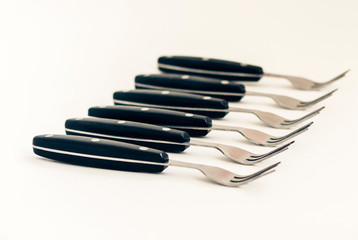Close up six forks isolated on white background.