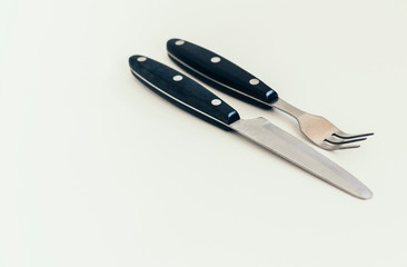 Close up knife and fork isolated on white background.