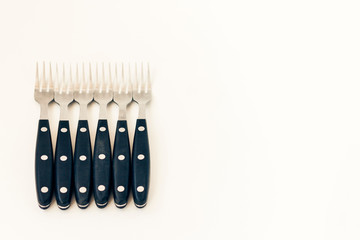 Close up six forks isolated on white background.