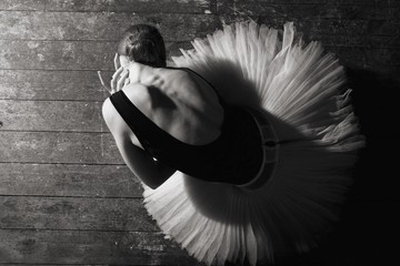 Ballerina in ballroom. Ballet dancer in studio. Black and white monochrome. Art of ballet.