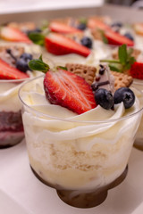 dessert in a glass decorated with berries