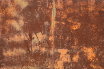 Rusty textured metal surface. The texture of the metal sheet is prone to oxidation and corrosion.