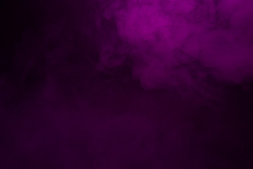 Colorful smoke close-up on a black background