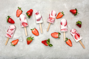 Fresh fruit popsicles. Juicy homemade ice cream with strawberry fruits, snack food, refreshing frozen dessert for summer.