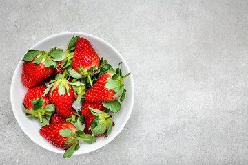 Fresh strawberry on plate, top view