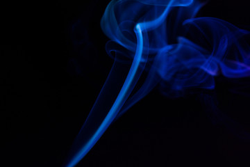 Colorful smoke close-up on a black background