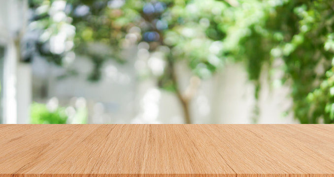 abstract blurred home garden with plank table for show,promote,ad product on image concept	