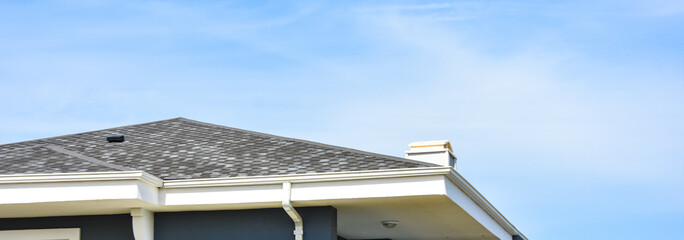 Asphalt roofing shingles,sky background