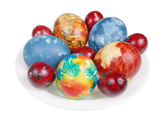 Fototapeta na wymiar Easter chicken and quail eggs painted with natural food dye - onion peel and cabbage isolated