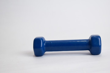 Close up Blue dumbbell for fitness isolated on white background