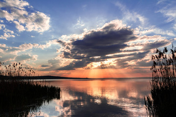 Sunset on a lake, landscape.Beautiful nature.Blue Sky and clouds