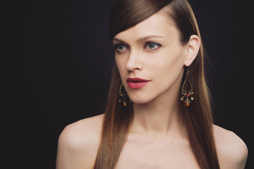 Fototapeta premium Portrait of a beautiful woman is wearing jewelry
