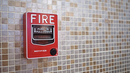 Emergency of Fire alarm or alert or bell warning equipment in red color in the building for safety.