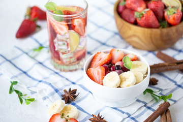 Healthy breakfast muesli with banana strawberries and berries