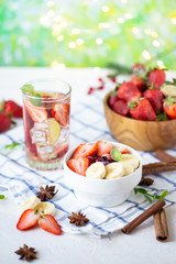 Healthy breakfast muesli with banana strawberries and berries