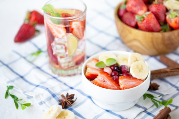 Healthy breakfast muesli with banana strawberries and berries
