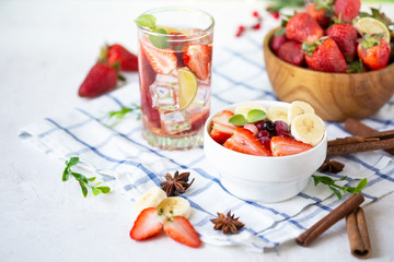 Healthy breakfast muesli with banana strawberries and berries