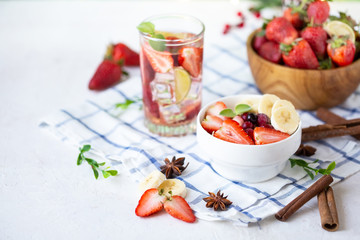Healthy breakfast muesli with banana strawberries and berries