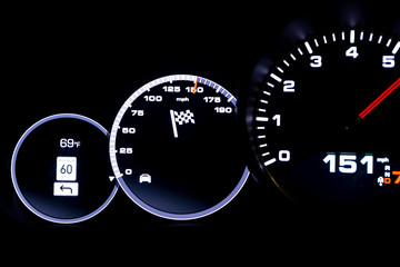 Modern light car mileage on black background