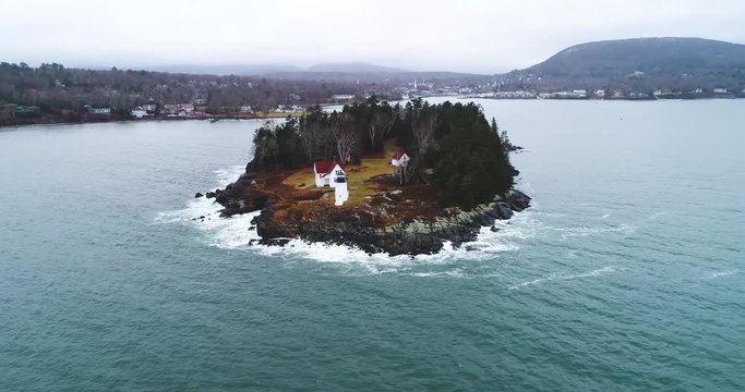 Zooming aerial shot of Curtis island lighthouse Camden Maine USA