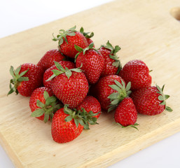 Strawberry with sliced half isolated on white background.