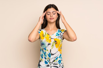 Obraz na płótnie Canvas Teenager girl with floral dress with headache
