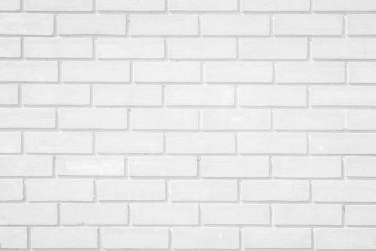 Fototapeta Wall white brick wall texture background. Brickwork or stonework flooring interior rock old pattern clean concrete grid uneven bricks design stack.