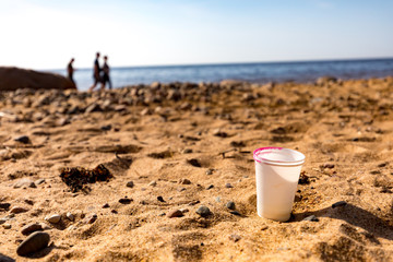 Plastic cups by the beach in Latvia